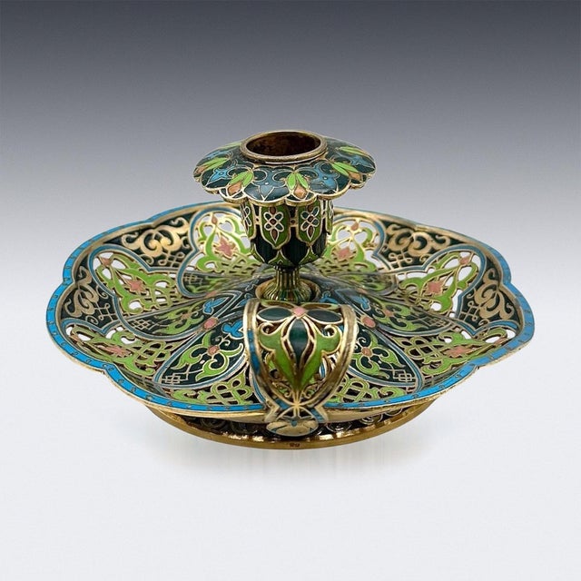 Antique latet-19th Century French import candlestick holder, crafted in silver gilt and decorated with vibrant champlevé...