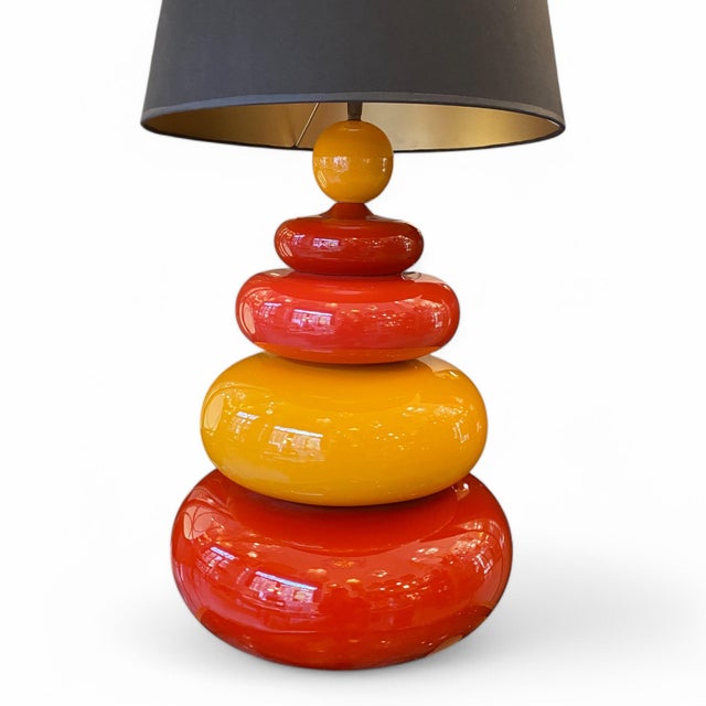 A table lamp in true 80s style, crafted from red, orange, and mustard yellow ceramic. Made by the French firm Albret, this...