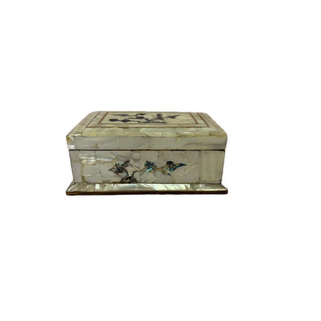 Handcrafted in Egypt, this elegant wooden jewelry box is beautifully decorated with genuine Mother of Pearl inlay and...