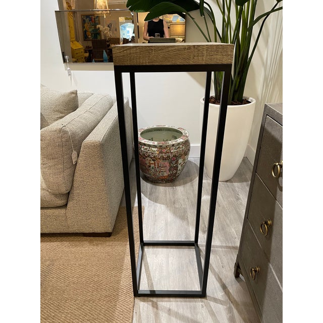 Enhance your space with this sleek and classic pedestal, featuring a beautifully finished wood top paired with a sturdy...