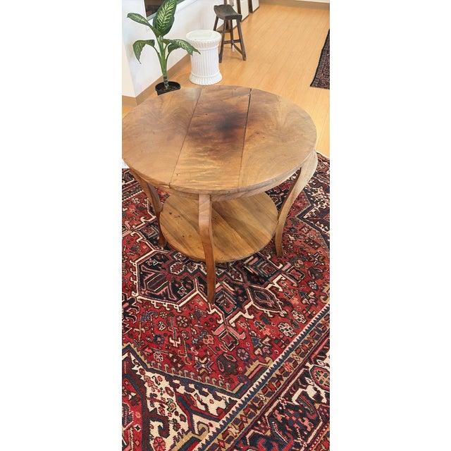 Beautiful Hawaiian, handcarved Koa wood side table with a round top over a lower tier.