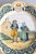 A charming antique French faience Quimper hand painted couple plate, circa 1895. Maker's mark on front. This lovely large...