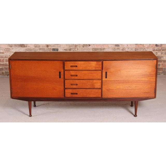 Mid Century teak sideboard by Meredew, circa 1960s. Two cabinet sections and 4 drawers, felt lined cutlery drawer on top....