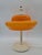 A striking table lamp in the space age/mid-century modern style, made in Europe in the 1970s. Its standout feature is the...