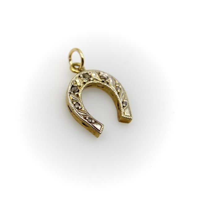 This sweet little 14k gold horseshoe pendant has a lot of charm. On the front is delicate hand-engraved workmanship with...