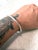 Sleek vintage sterling silver hinged bracelet with hammer design.