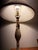 Exhibiting the timeless elegance of natural stone, this mid-century modern table lamp is masterfully carved from a single,...