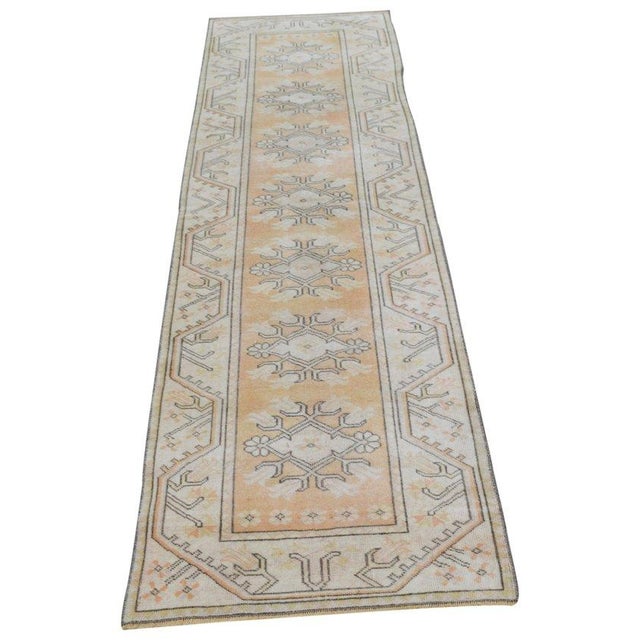 Hand-knotted with care using traditional rug-making techniques, this wool rug blends timeless craftsmanship with a modern...