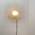Minimalist sconces with an industrial and modernist vibe. Consists of an oval-shaped domed diffuser in ribbed-molded...