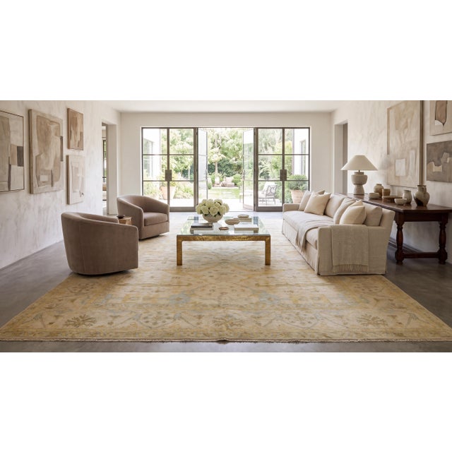 Elegantly blending traditional Turkish heritage with contemporary sophistication, this modern Oushak-style area rug...