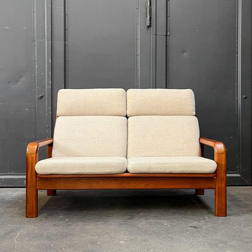 Product: two-seater sofa. Style: mid-century (1960s/1970s). Material: solid teak, light woven upholstery. Features:...