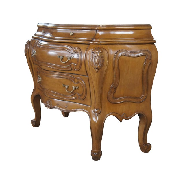Two vintage bombe chests or commodes. Made of walnut featuring ornate French and Italian styling with two petite glove...
