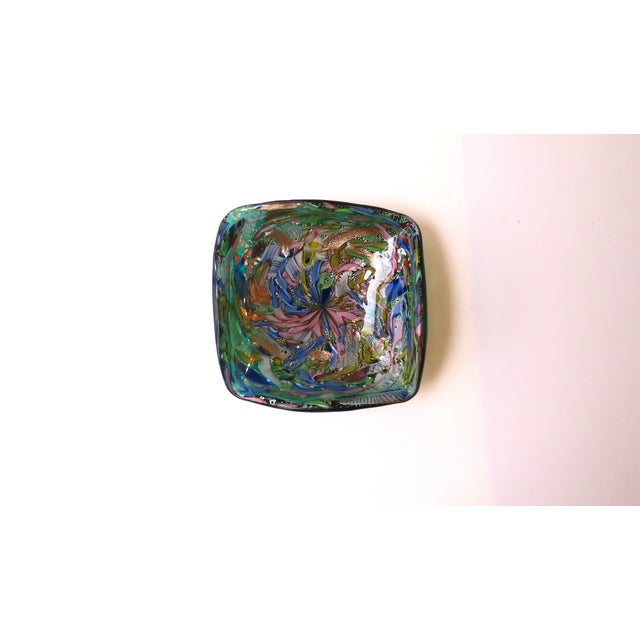 A substantial Italian Murano bowl with a swirled ribbon design, Midcentury Modern design period, circa mid‑20th century,...