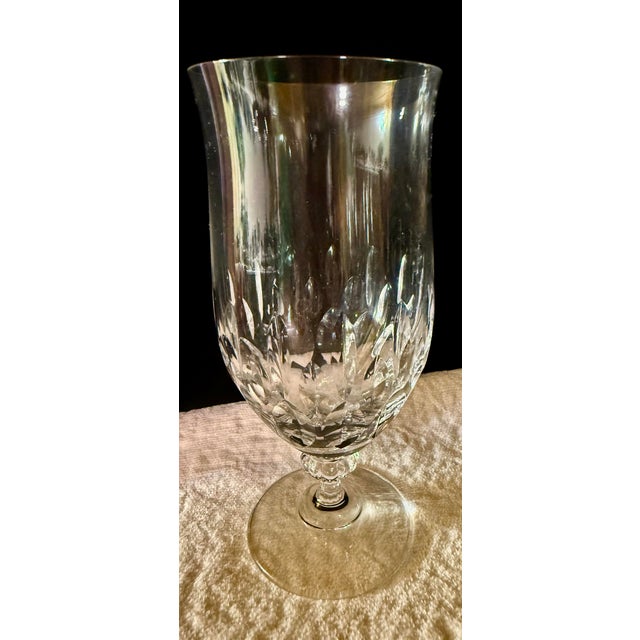 This collection features an elegant assortment of vintage lead crystal stemware including seven wine glasses and seven...