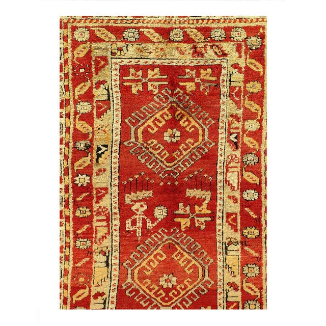Add a touch of vintage charm to your home with this Turkish Rug. Handmade with 100% wool, this area rug features a...