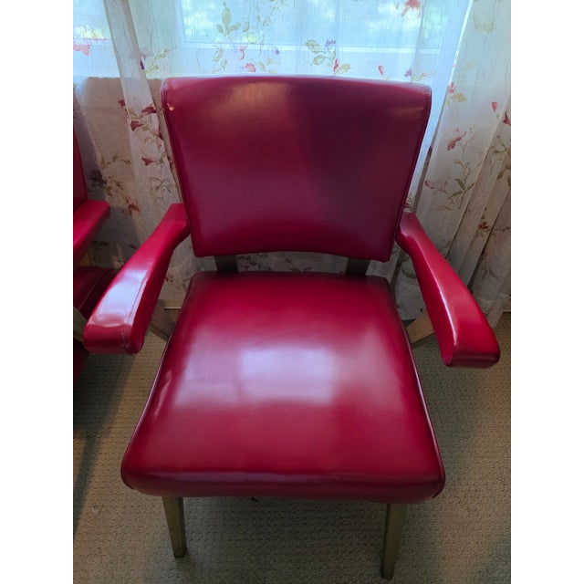 Viking Artline red vinyl armchairs! All original condition with hardly any signs of wear, both date stamped 1953, one...