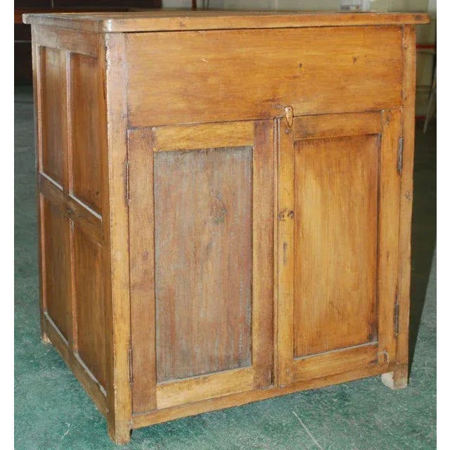 Nicely made teak cabinet with hinged top and two doors. We have a nearly identical second piece for a matched pair.