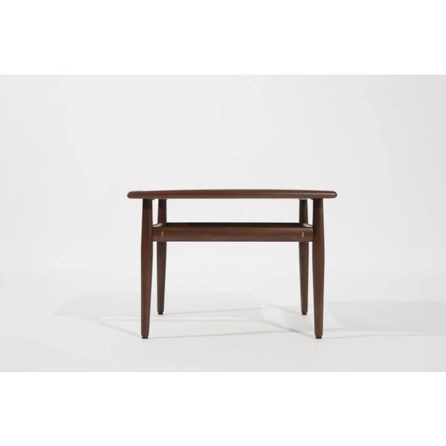 Indulge in the enduring charm of mid-century modern design with our meticulously restored Teak Coffee/End Table, a 1950s...