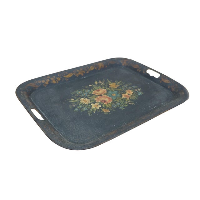 Antique black metal toleware bar serving tray. Rounded rectangular form with pierced handles at the edge. Border painted...
