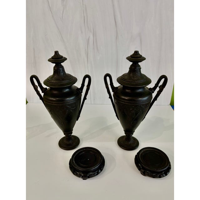 Vintage/antique pair of neoclassical cast iron urns - possibly attributable to J.L. Mott Ironworks (see initials J.L. on...