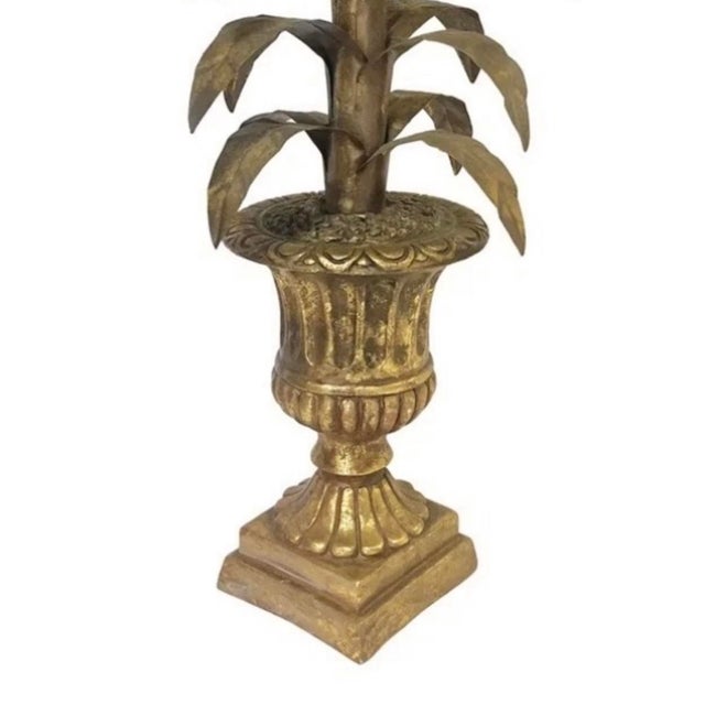 A gorgeous, vintage tole palm sculpture. Features a stylized, tole palm plant/tree potted in a cast, neoclassical urn....