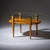 Coffee table with glass top on square tapering legs with brass sabots and intermediate shelf. The glass top is rounded on...
