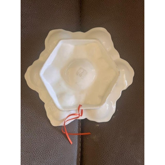 This vintage oyster plate by Two's Company features a distinctive six-well floral-themed design with a central circular...