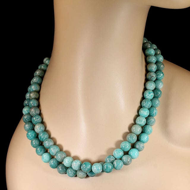 This elegant 19‑inch Peruvian Amazonite necklace features two beautifully coordinated strands of 10mm highly polished...
