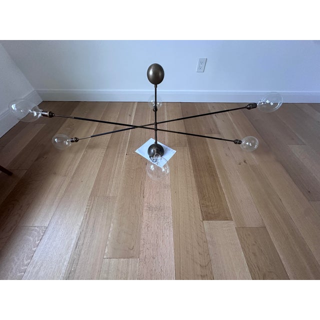 Apparatus "Highwire" size large with bronze finish with 2 tandem pendant lights each on 2 long adjustable balance arms and...
