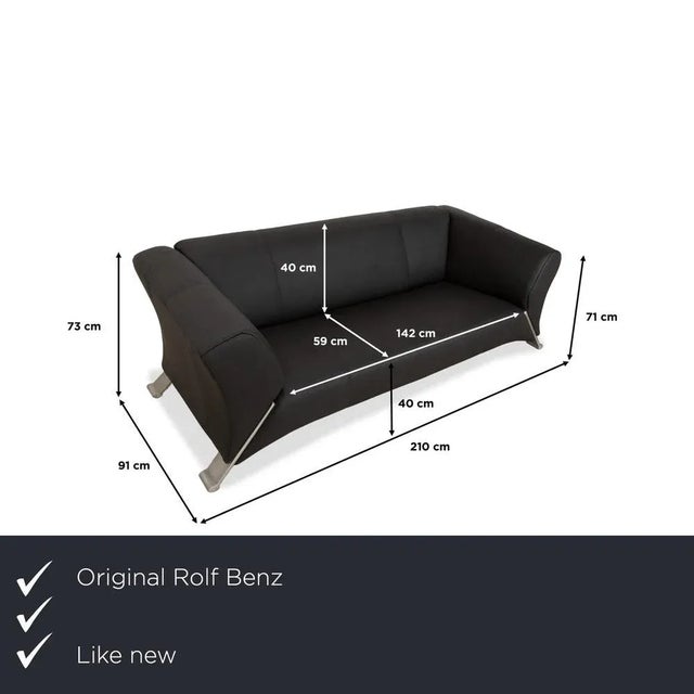 The Rolf Benz 322 sofa is upholstered in anthracite-colored leather and stands on angled metal legs. This two-seater is...