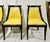 Set of four Empire-style gondola dining chairs with ebonized wood frames, curved backs, tapered saber legs, and antique...