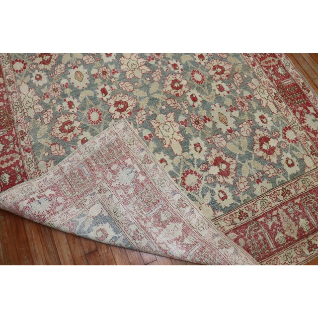 A room-size antique Persian Tabriz rug woven from the early 20th century. Measures: 6'3'' x 9'10''.
