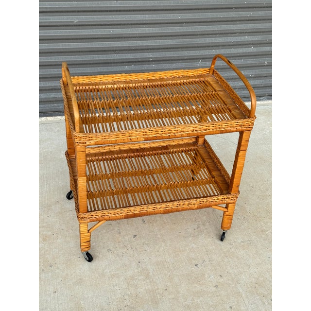 C. 1970s mid-century modern Italian rolling bar cart in the style of Franco Albini. Dimensions Length: 24 in Depth: 15.75...