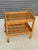 C. 1970s mid-century modern Italian rolling bar cart in the style of Franco Albini. Dimensions Length: 24 in Depth: 15.75...