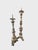 Sculptural asymmetrical pair of antique Italian carved wood candlesticks featuring a layered painted finish with parcel-...
