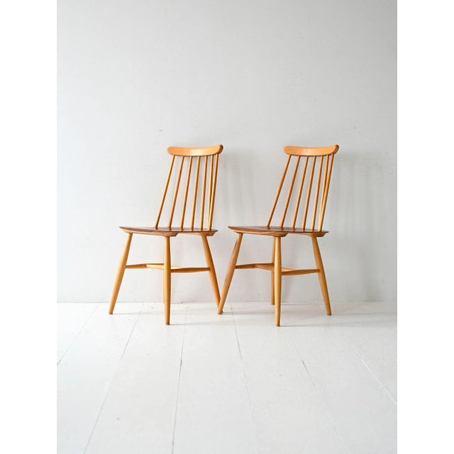 Pair of Fanett chairs designed by Ilmari Tapiovaara and produced by Edsby Verken in Sweden in the 1960s. The frame is...