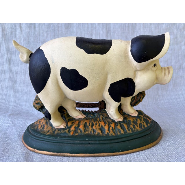 Sweet, vintage cast iron happy, black and white spotted pig doorstop. Heavy. No marks. Some minor surface wear consistent...