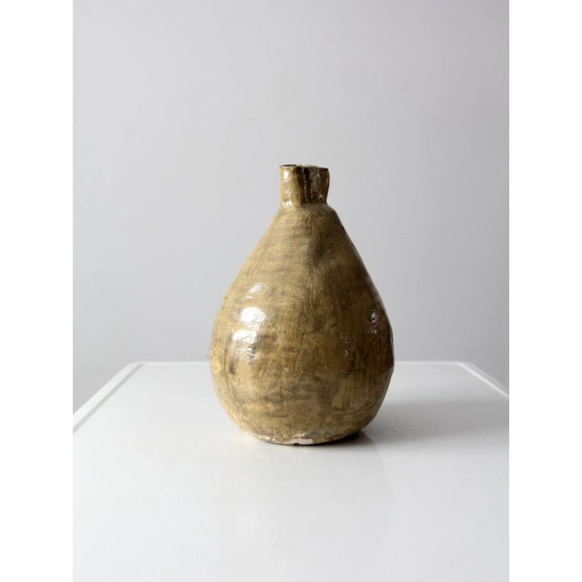 A large free-form studio pottery vase dating to the late 20th century, hand-crafted with an expressive, sculptural...