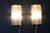 This magnificent pair of glass wall sconces is made of frosted Murano graniglia glass and brass. A very unusual design....