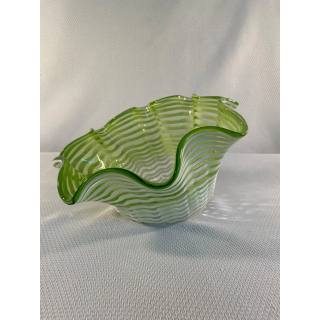 A gorgeous hand blown lime green Italian Cased Art Glass Bowl with white swirls and ruffled edges. Circa 1960s. This...
