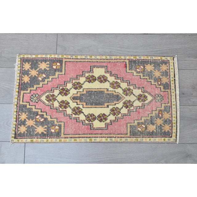 This is a vintage Turkish Oushak rug from the 1960s. The piece was hand-knotted.
