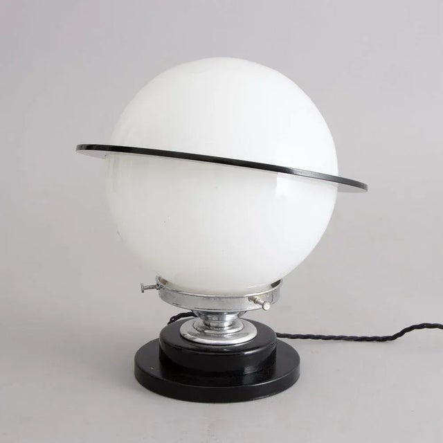 Art Deco Saturn Table Lamp with Black Acrylic Ring, in Very Good conditions. Designed 1920 to 1949 UK Plug (up to...