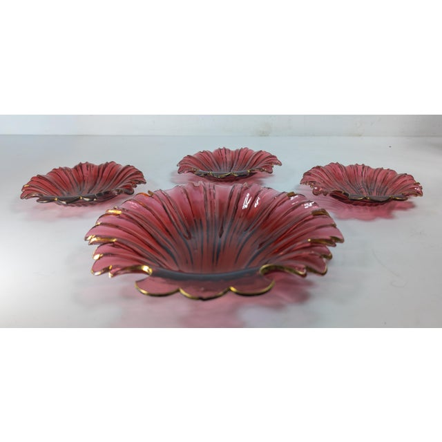 We are selling this great group of Ruby Red Cranberry glass nut dishes. This group has one large shell form dish with...