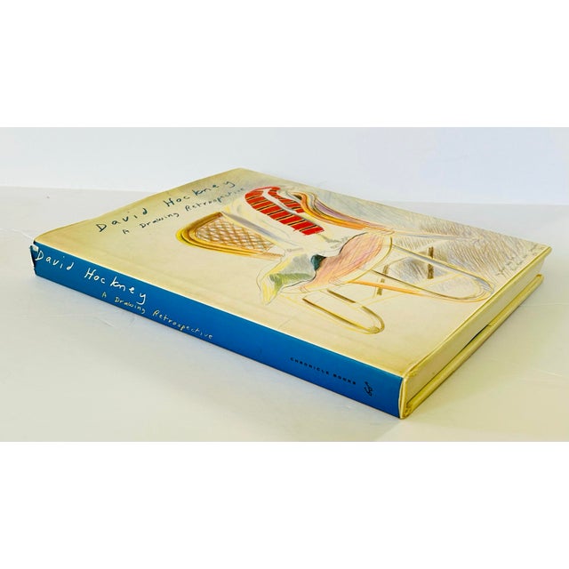 David Hockney: A Drawing Retrospective, edited by Ulrich Luckhardt, is a comprehensive book showcasing David Hockney's...