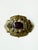 Lovely art nouveau brass sash pin with purple glass or crystal cabochon set center stone. Abstract design. Measures...
