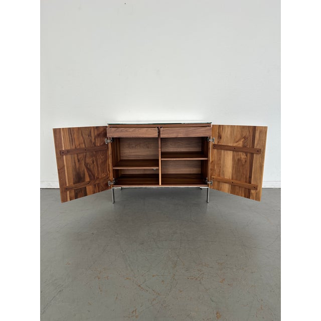 Sleek and solid, our Kenwood bar cabinet with ceramic top makes a sophisticated addition to your home or office. This bar...