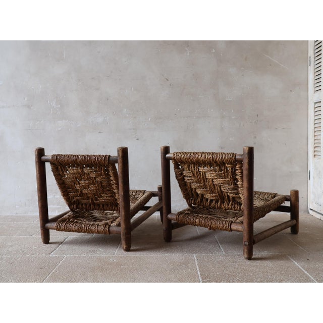 (Near) Pair of lounge chairs by the French duo Adrien Audoux & Frida Minet for Vibo Vesoul (circa 1950). The chairs embody...