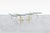 A remarkable example of sculptural design, this vintage brass coffee table transforms functional furniture into a...