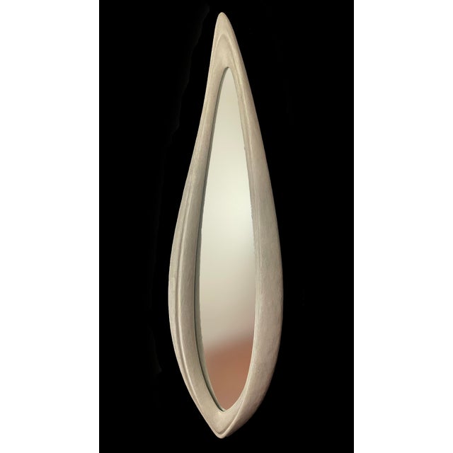 Mirror No. 2 is a large-scale wall-mounted mirror object designed by Chris Delmar. Its elongated vertical form combines a...