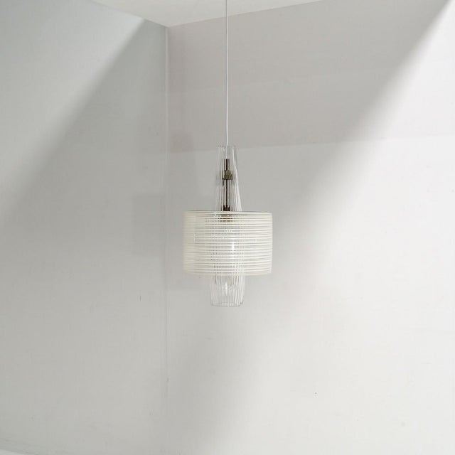 This “Venezia” pendant by Aloys F. Gangkofner for Peil & Putzler is a beautiful sculptural lighting design, where...